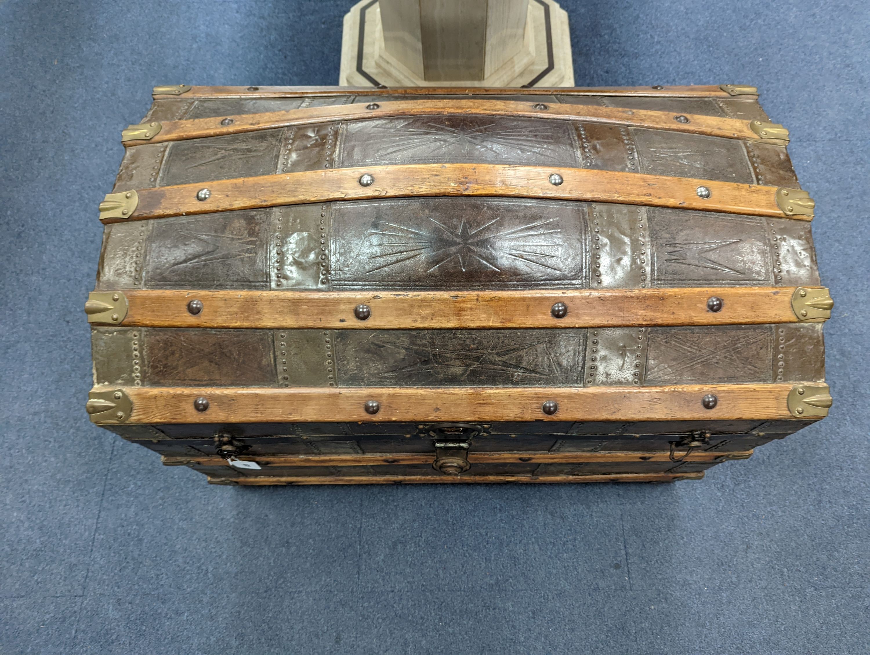 A Victorian leather bound dome top trunk, length 88cm, depth 50cm, height 60cm